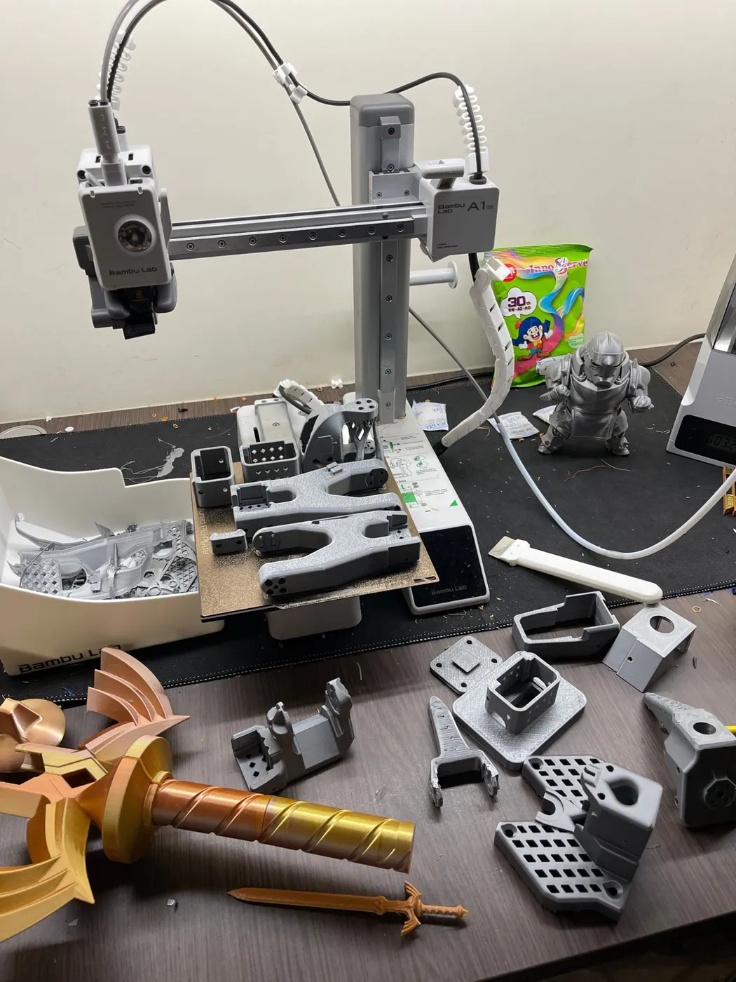 A 3D printer bed full of SO-101 arm parts