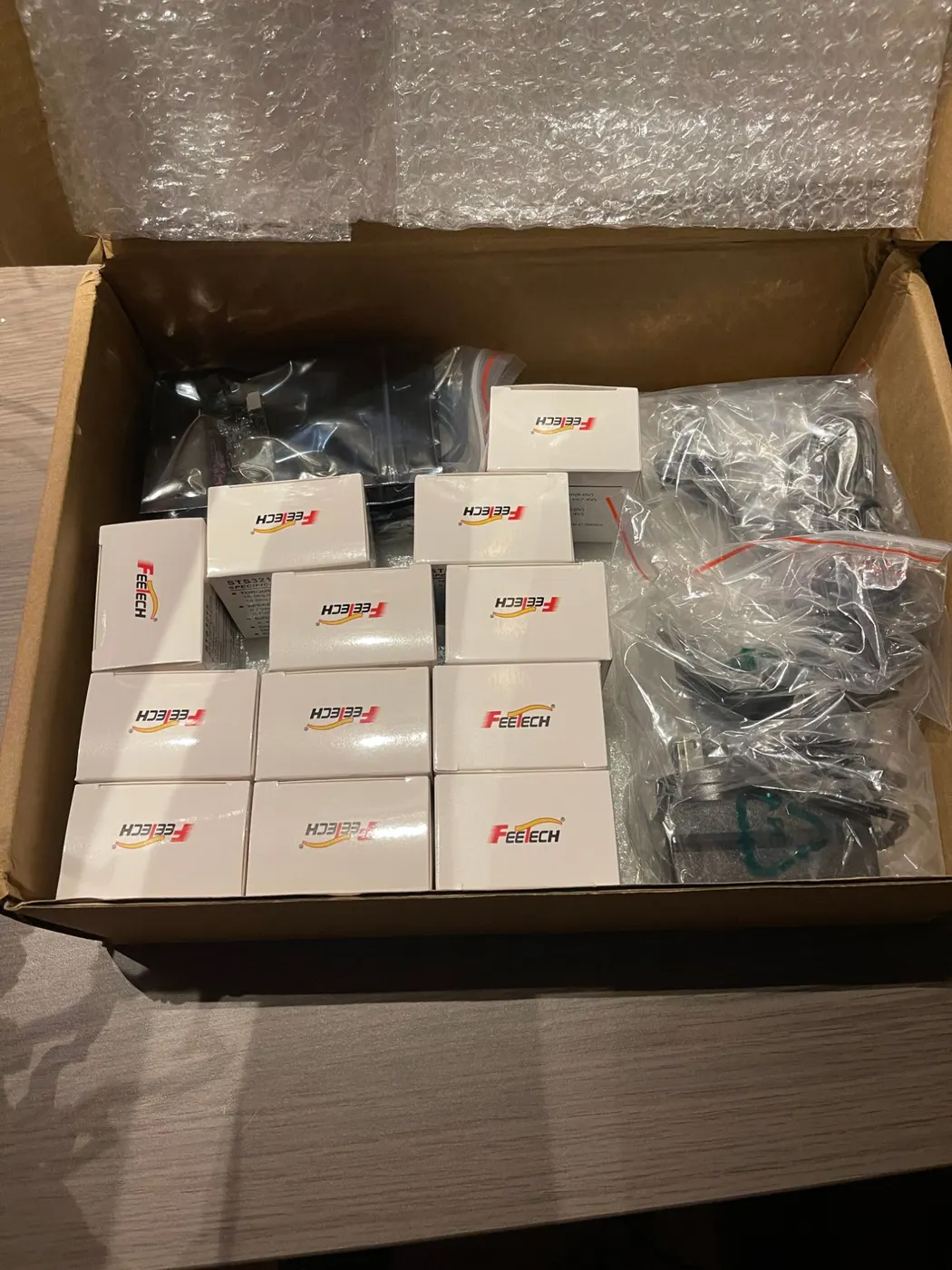 A stack of small Feetech servo boxes